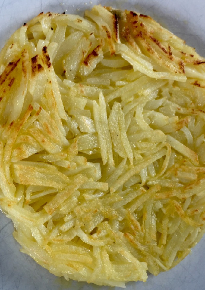 Una foto de Rösti originario suizo