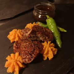 Lamb steak dive in chocolate sauce A picture of Lamb steak dive in chocolate sauce.