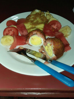 A picture of Sausage coated eggs.