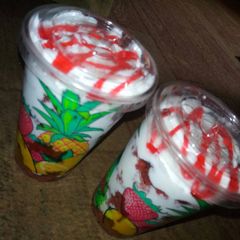 A picture of Trifle with strawberry topping sauce.