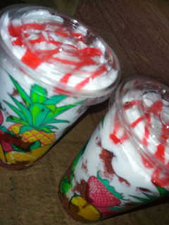 A picture of Trifle with strawberry topping sauce.