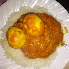 A picture of Rice and egg curry.