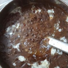 A picture of Dal bukhara with lacha prantha and rice.
