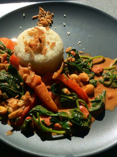 A picture of Cauliflower rice & chickpea tomato/curry sauce.