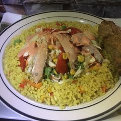 A picture of Fried rice and chicken salad.