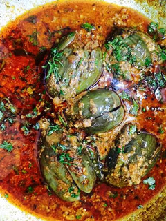 A picture of Stuffed egg plant (brinjal).