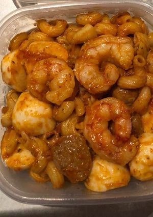 A picture of Pasta jollof and shrimp.