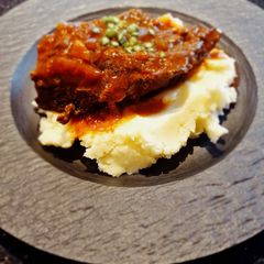 A picture of Slow Braised Beef Cheek in Guinness with Champ.