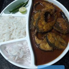 A picture of Rohu fish with mustard gravy.
