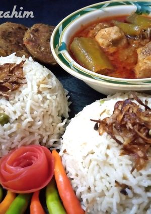 A picture of Matar Pulao Achaar Gosht Shami kabab.