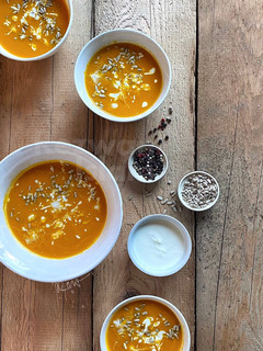 A picture of Carrot ginger soup with yogurt.
