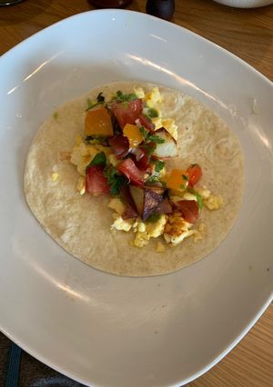 A picture of Vegetarian breakfast tacos with pico de gallo.