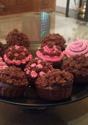 A picture of Chocolate cupcakes with Icing.
