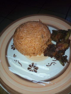 A picture of Jollof Rice and Chicken.