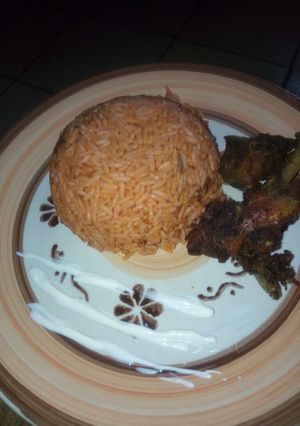 A picture of Jollof Rice and Chicken.