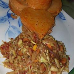 A picture of Moi moi with vegetables sauce.