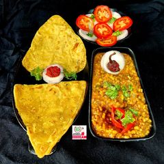 A picture of Moong Moth Masala With Tikona Paratha.