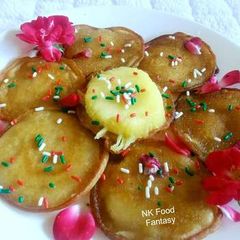 A picture of Pineapple Malpua in Rose Water Syrup.