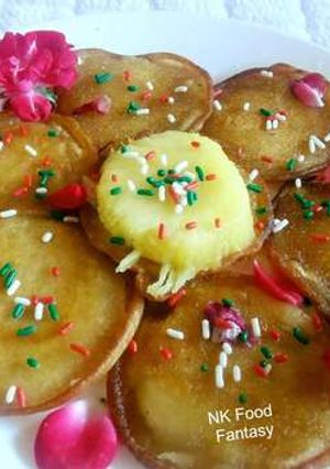 A picture of Pineapple Malpua in Rose Water Syrup.