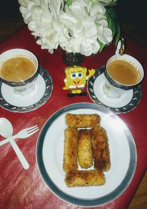 A picture of Bread crumbs chicken rolls with elaichi tea.