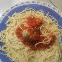 A picture of Spagetti with sauce and stew.