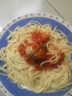 A picture of Spagetti with sauce and stew.