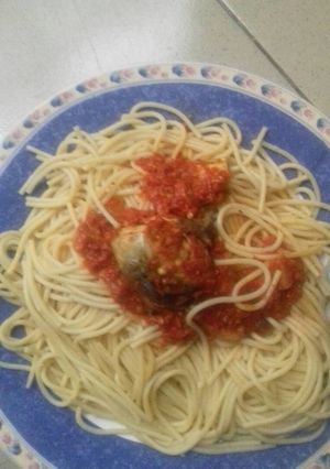 A picture of Spagetti with sauce and stew.