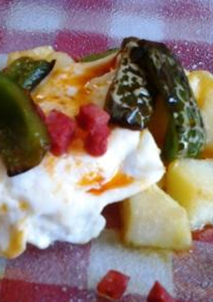 Una foto de Huevos rotos