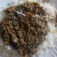 A picture of Rice and greengrams stew.
