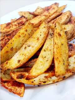 Una foto de Patatas gajo picantes al horno