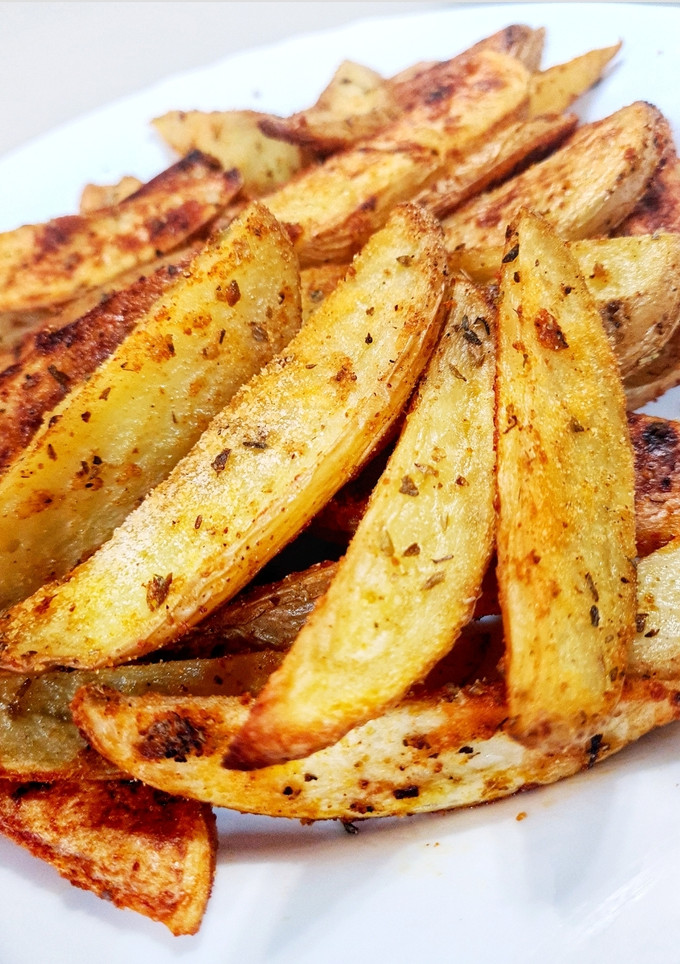Una foto de Patatas gajo picantes al horno