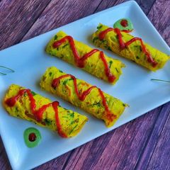 A picture of Stuffed moong dal chilla rolls.
