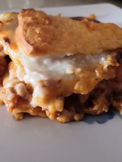 Una foto de Lasaña carne y bacon
