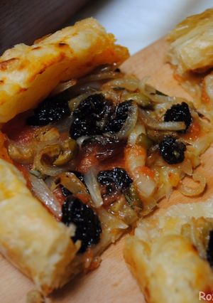 A picture of Puff pastry pizza with Raisins & bell pepper.