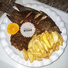 A picture of Chips and grilled Fish.