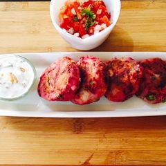 A picture of Beetroot onion patties with Peanut sauce.