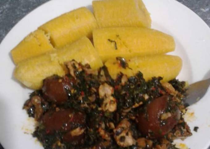 Boiling plantain and ugu stew