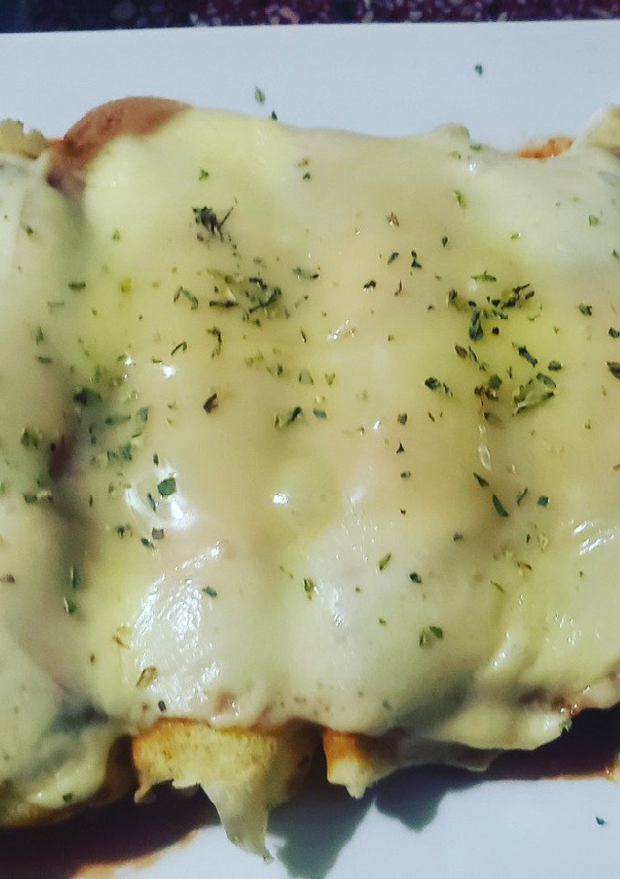 Una foto de Canelones de carne y jamón y queso