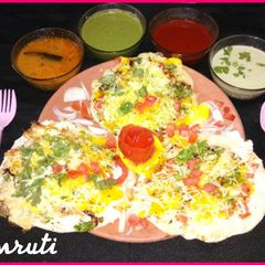 A picture of Cheesy Egg Uttapam.