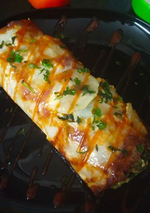 A picture of Scalloped Potato Spinach Roll.