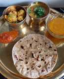 Sukhi Bhaaji Khati meethi dal and fulka roti - a Gujarati Thali