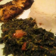 A picture of Pan fried fish served with ugali, managu and terere.