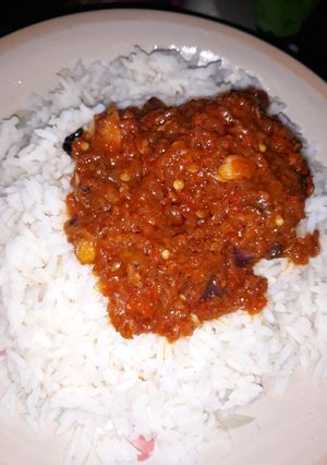 A picture of White rice and red oil stew.