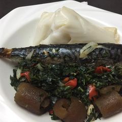 A picture of Agidi with fish vegetable sauce.