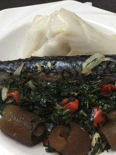 A picture of Agidi with fish vegetable sauce.