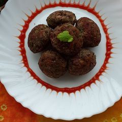 A picture of Black gram paneer paniyarams.