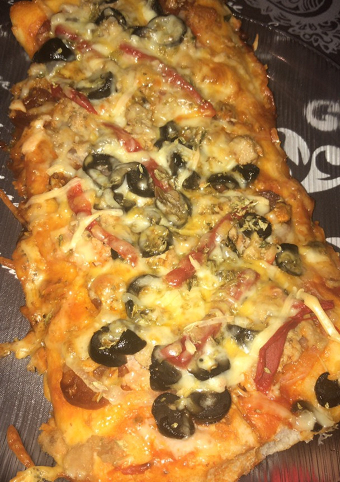 Una foto de Pizza (masa e ingredientes caseros)