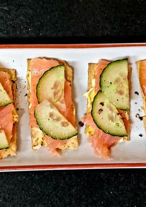 A picture of My pineapple + Almond Roulè with Smoked Salmon on cracker #Snack.