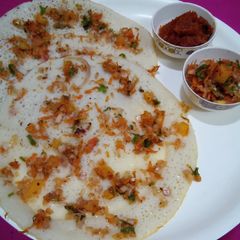 Tomato onion uttapam A picture of Tomato onion uttapam.