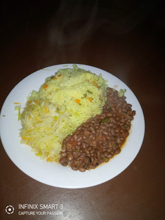 A picture of Tumeric rice, beans and steamed cabbage.